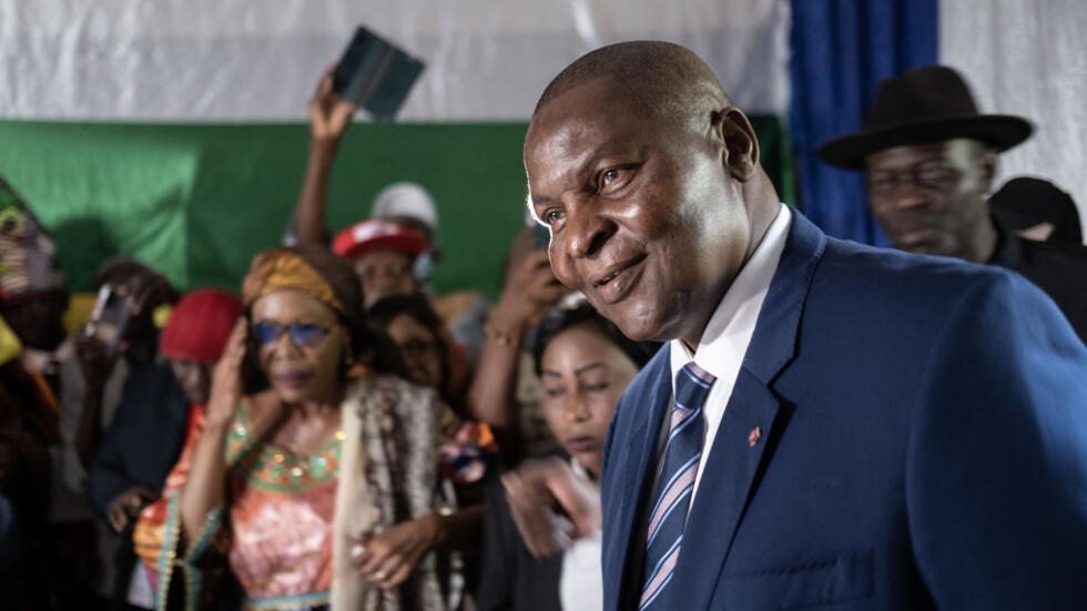 Central African Republic President Faustin Archange Touadera (R) smiles as he arrives to vote on the new constitution on July 30, 2023.