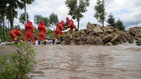 Dozens dead and thousands evacuated over flooding in northern China