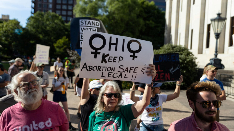 An abortion rights protester holds a sign to keep abortion safe in Ohio at a rally in Columbus, after the United States Supreme Court ruled to overturn the landmark Roe v Wade abortion decision, June 24, 2022.
